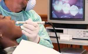 Dentist preparing dental scanner tool for digital impressions | 24th Street Dental in Phoenix, AZ