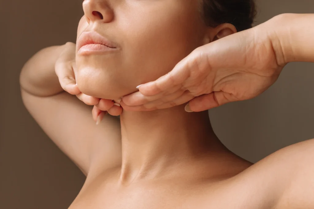 Woman highlighting jawline area related to Kois Deprogrammer treatment in Phoenix, AZ | 24th Street Dental Biltmore